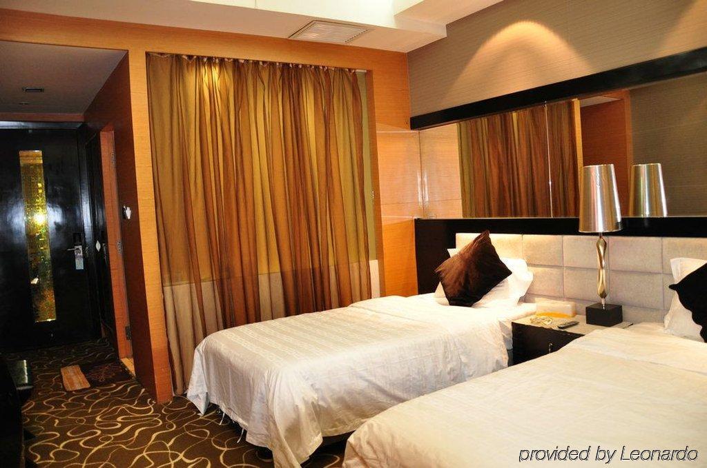 Harbin Yakelai Holiday Hotel Quarto foto