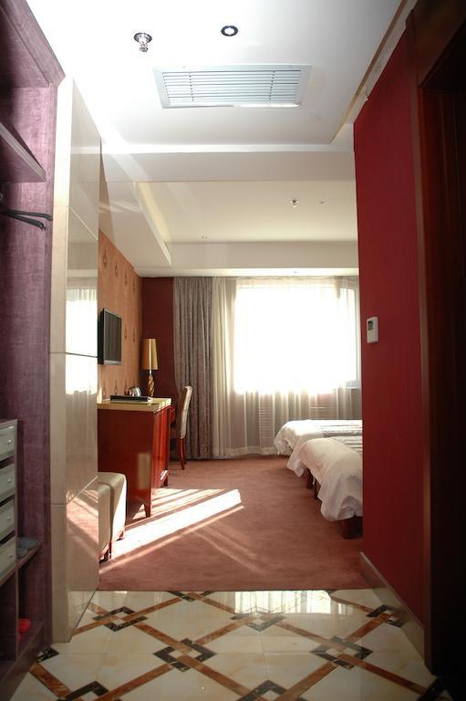 Harbin Yakelai Holiday Hotel Quarto foto