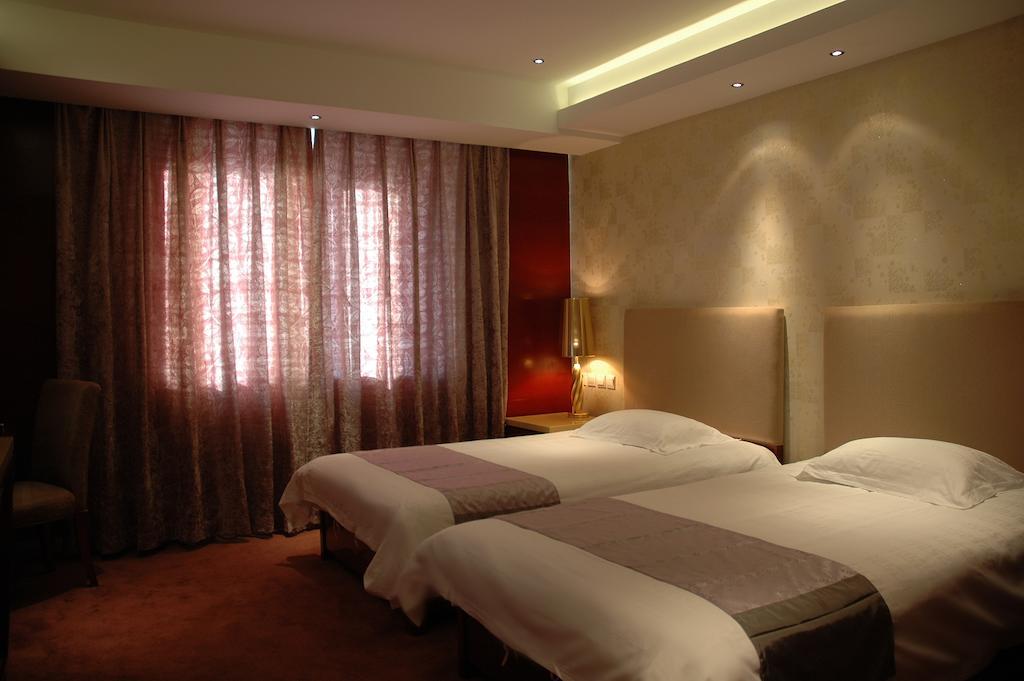 Harbin Yakelai Holiday Hotel Quarto foto