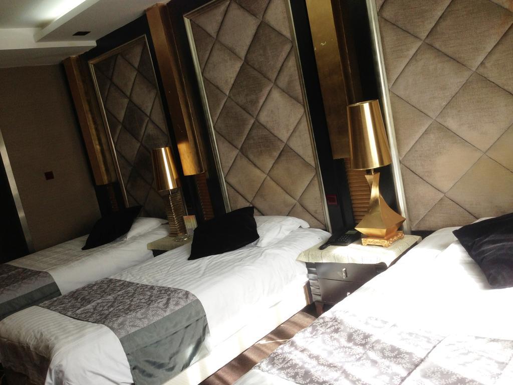 Harbin Yakelai Holiday Hotel Quarto foto
