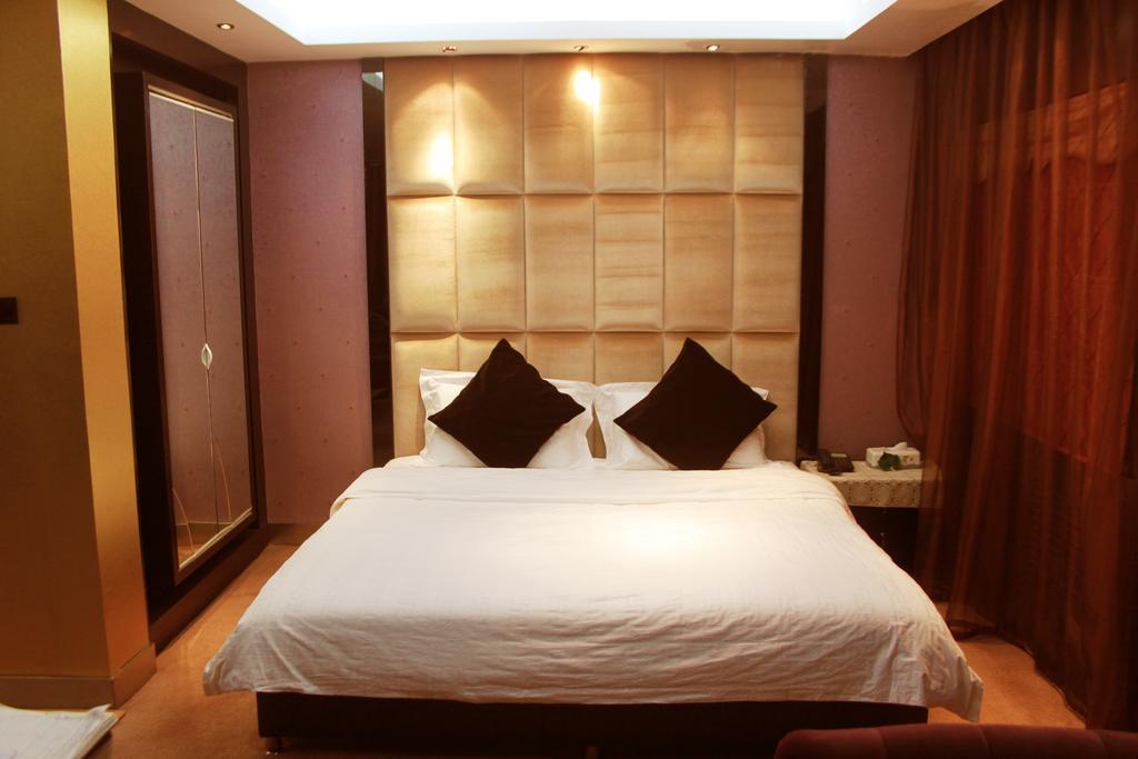 Harbin Yakelai Holiday Hotel Quarto foto
