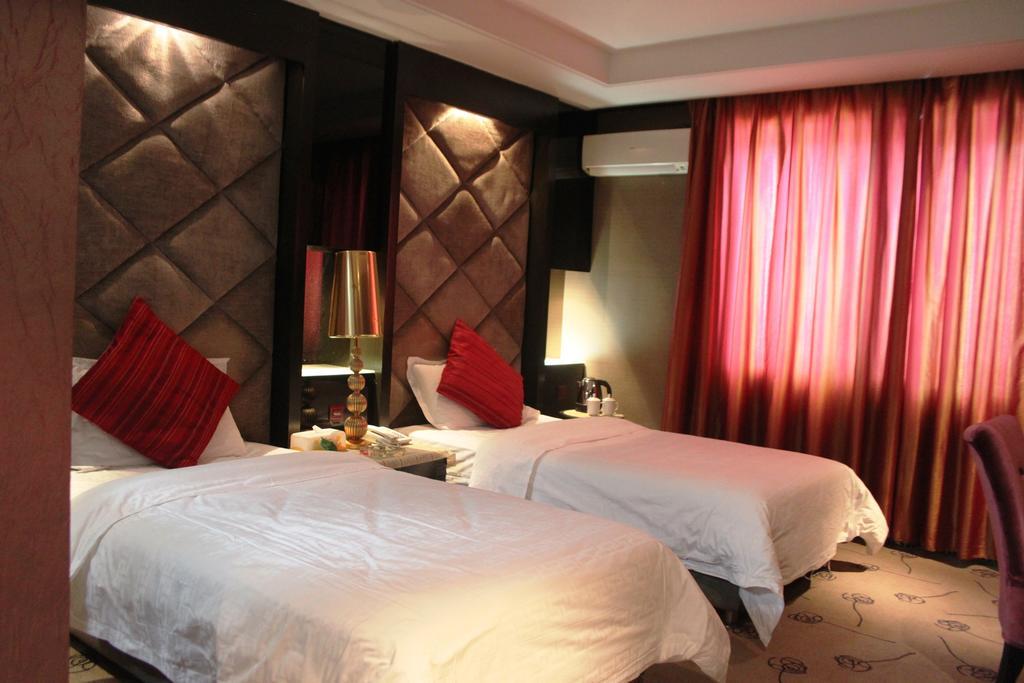 Harbin Yakelai Holiday Hotel Quarto foto